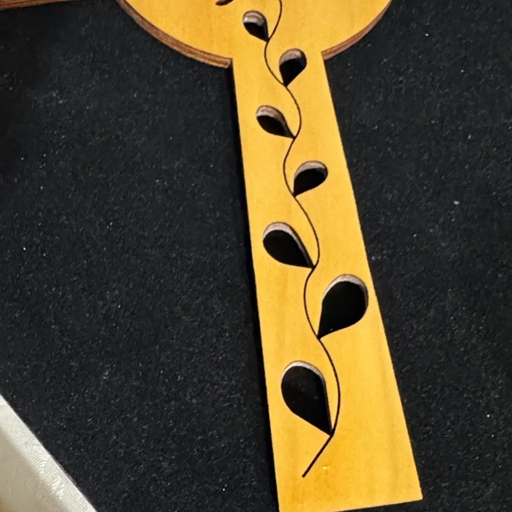 Wooden Celtic cross with a rose and vine cut-out design